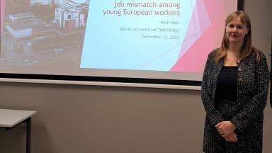 presenter in front of the slides