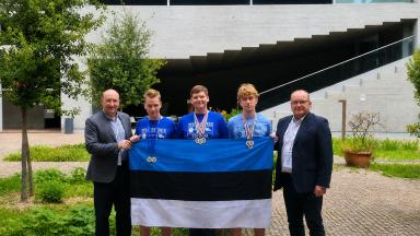 five men with Estonian flag