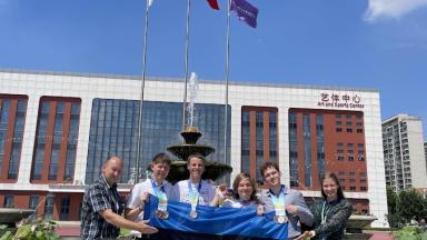 a group of people holding Estonian flag