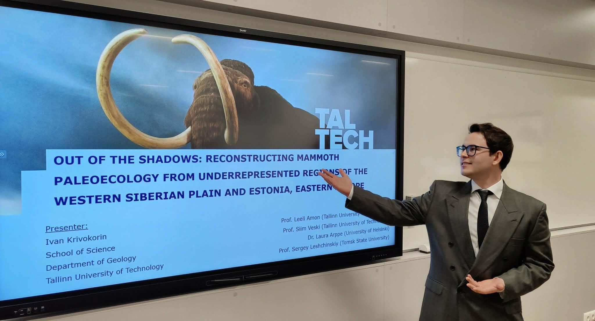 A young man giving a presentation (about mammoths)