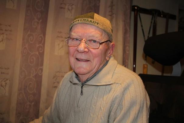 elderly man with glasses