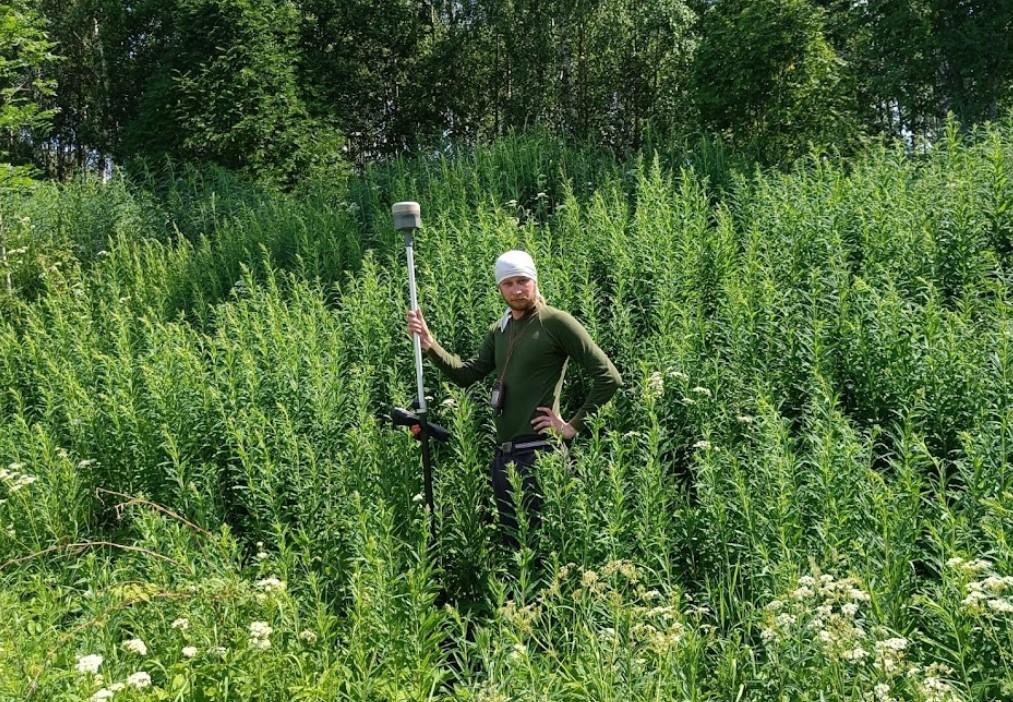 man standing in high grass
