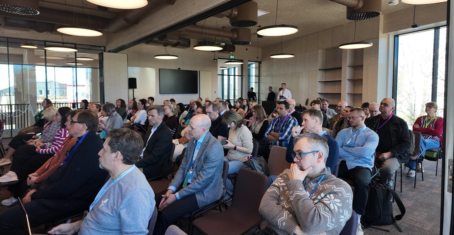 many people sitting in a hall