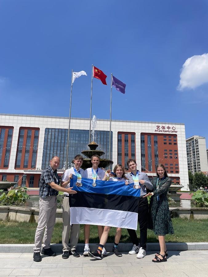 a group of people holding Estonian flag